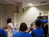 trainer demonstrating use of 
pressure care mattress